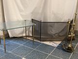 pair of brass and glass side tables with a glass top
