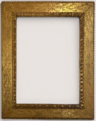 a gold picture frame with a decorative pattern on it