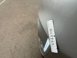 a sticker on the hood of a car with a ruler attached to it