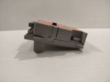 a gray and orange object on a white surface