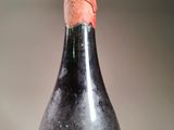 a bottle of wine with a cork on the top