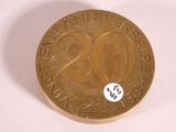 a gold coin with the number twenty on it