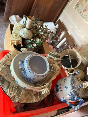 a red tray with a bunch of dishes and cups on it