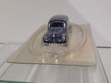 a small toy car on a clear display case