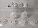 six cups and six saucers in a clear box