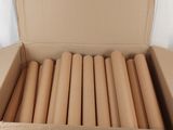 boxes of cardboard are stacked on top of each other on a table