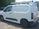 a white van that is parked in a parking lot