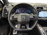 the interior of a car with a steering wheel and dashboard controls