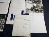 a lot of old photos and letters on the table
