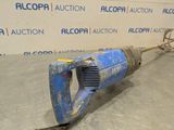 an image of a blue electric drill in a room