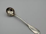 silver spoon with a spoon handle on a white surface