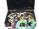a black case with a bunch of jewelry inside of it
