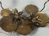 a gold plate with a bunch of flowers on it