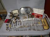 a table with a lot of silverware on it