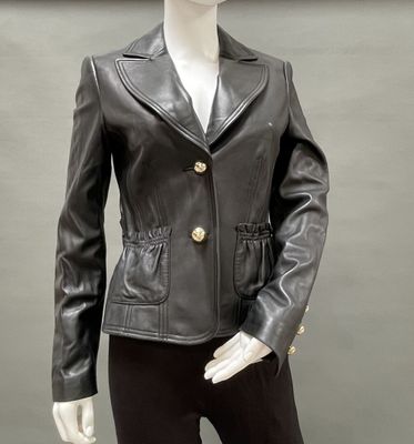 a mannequin wearing a black leather jacket and black pants