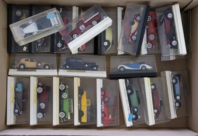 a lot of toy cars in a box on the floor