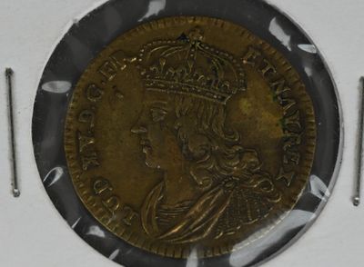 l'image d'une pièce d'or ornée d'une couronne
