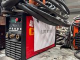 a lot of welding equipment on a table in a warehouse