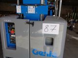 a machine that has a sign on the side of it
