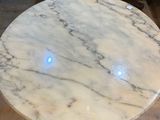 an image of a marble table with a blue light on it