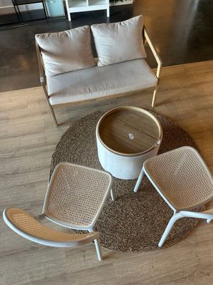 an overhead view of a living room with a couch, chair, and coffee table