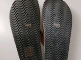 the soles of a pair of shoes on a white surface