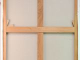 the window frame is made of wood and has no glass