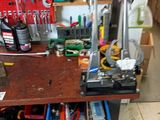 a workbench with tools on it in a garage