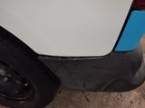a white car with a blue stripe on the side of it