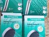four boxes of hand held shower heads sitting on a wooden surface