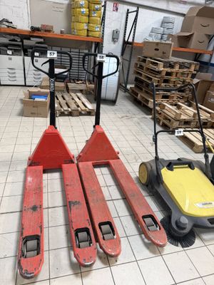 three pallets that are sitting on the floor in a warehouse