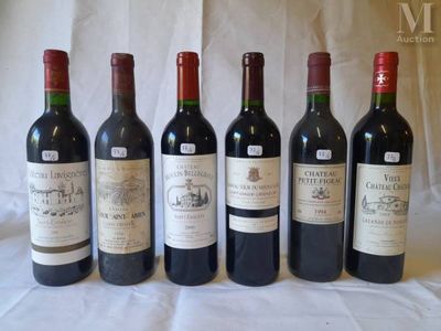 six bottles of wine are lined up on a table
