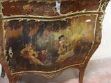 a picture of a chest of drawers with a painting on it