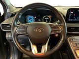 the interior of a car with a steering wheel and dashboard controls