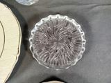 a glass plate and a glass bowl on a table