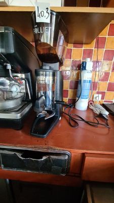 a coffee maker and a blender sitting on a kitchen counter