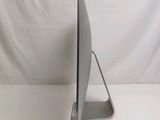 a laptop computer sitting on a stand on a white surface