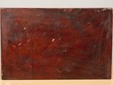 an old wooden box sitting on top of a table next to a white wall