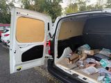 a white van that has a bunch of boxes in the back of it