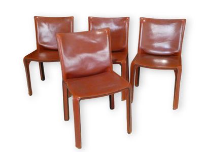 four brown leather dining chairs on a white background