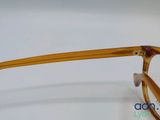 the glasses are made out of wood and have a clear lens