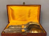 a box with silverware inside of it on a table