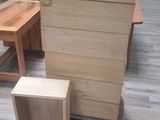 several pieces of furniture sitting on a wooden floor in a room