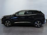 a black suv is parked in a room with a white wall