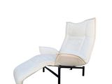 an image of a white reclining chair with a pillow on it