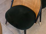 three chairs and a table in a room with tile flooring