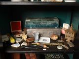 a book shelf with a bunch of items on top of it