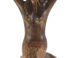 a statue of a mermaid holding a bowl on her head