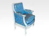 an image of a blue and white chair with a flowered upholstered back
