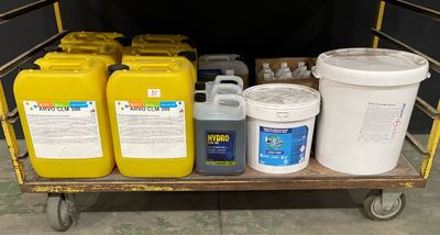 a cart with a lot of yellow and white containers on it